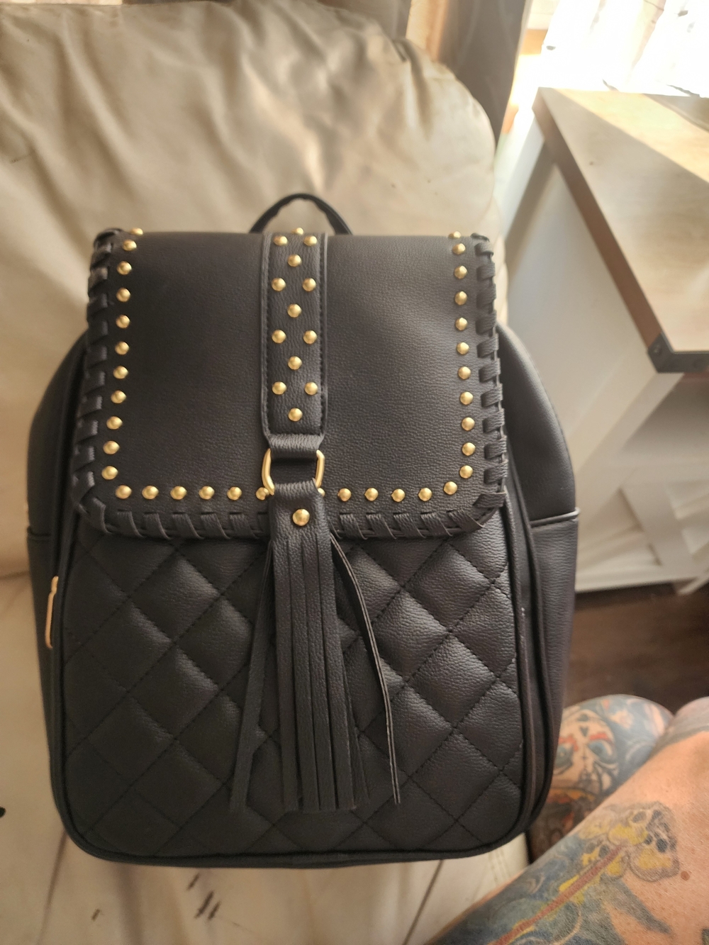 Black Quilted Tassel Backpack with Gold Stud Accents